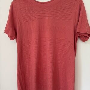 Lululemon Athletica Breeze By Short Sleeve Rustic Coral. Logo